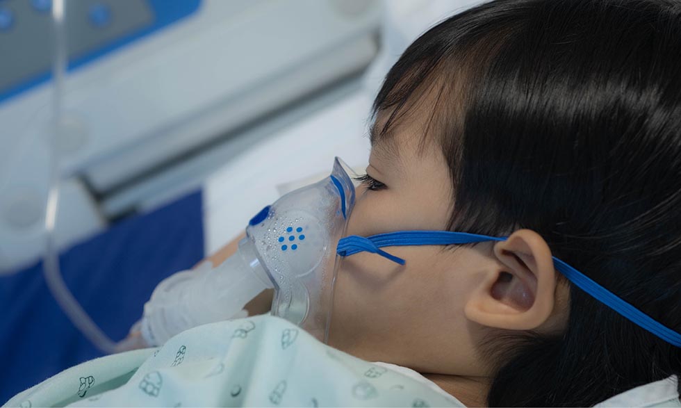 Young child wearing a respirator