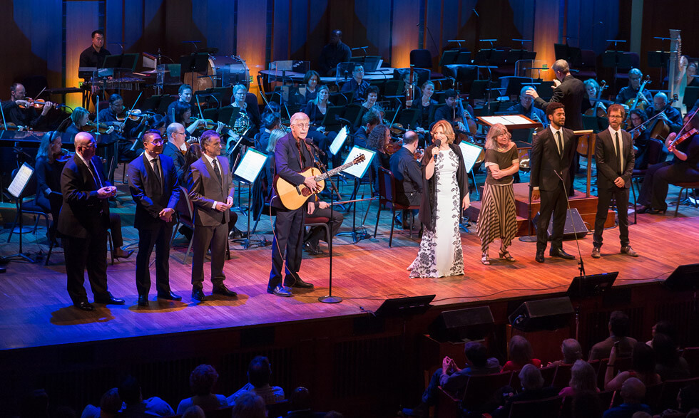 NIH Director Francis Collins, M.D., Ph.D. (left center), and Renée Fleming (right center) perform at NIH’s 2017 Sound Health event with other event leaders. 