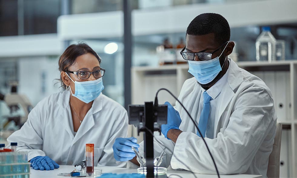 Two scientists working a lab