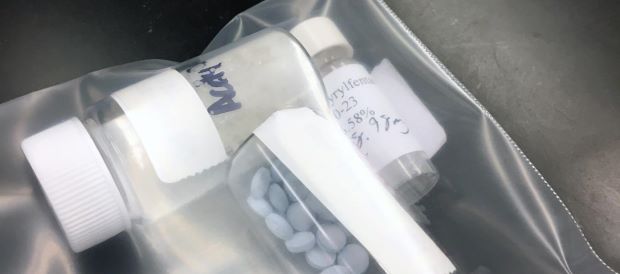 Labeled bottles of fentanyl pills and powders